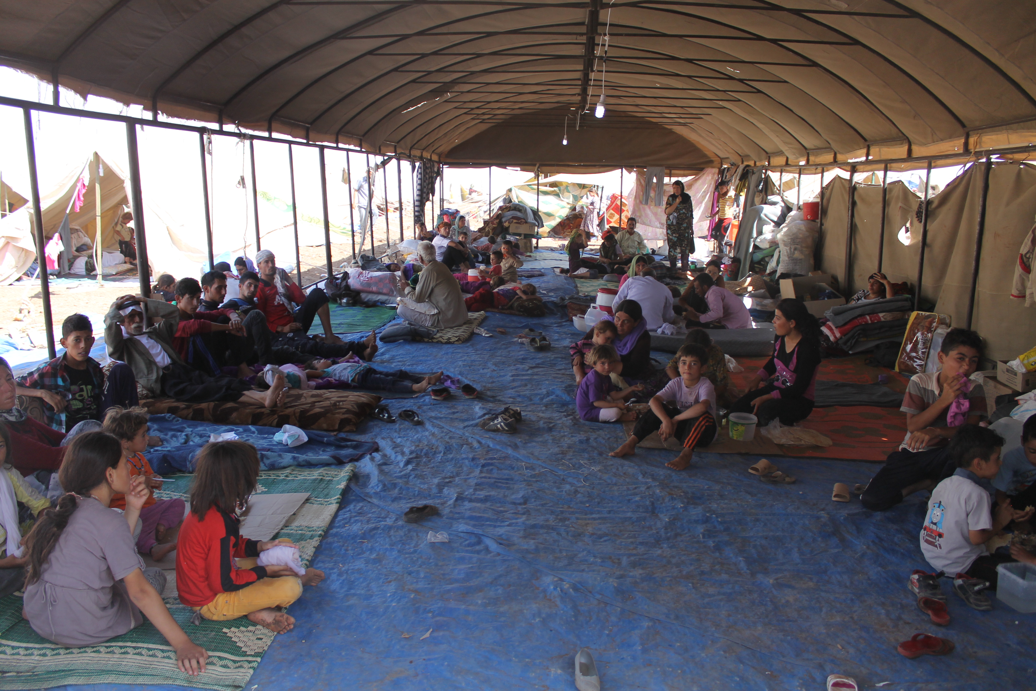 Iraqi_Yazidi_refugees_in_Newroz_camp_receive_help_from_International_Rescue_Committee_(14915495042)